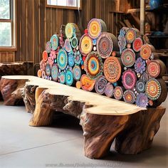 a bench made out of wood with colorful designs on it