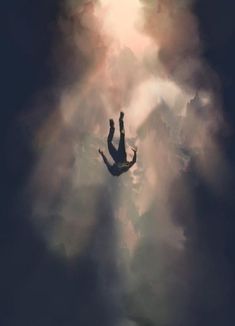 a person floating in the sky with their hands up