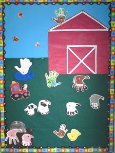 a bulletin board with farm animals on it and a red barn in the back ground