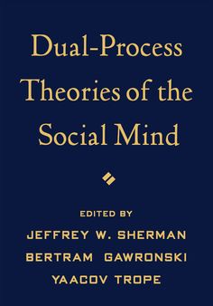 the cover of dual - process theory book, with blue background and gold lettering on it