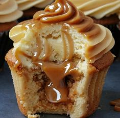 there is a cupcake with caramel icing on it