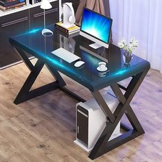 a desk with a computer on it in front of a bookcase and bookshelf