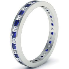 a white gold ring with blue sapphires and diamonds on the side, set in 18k white gold