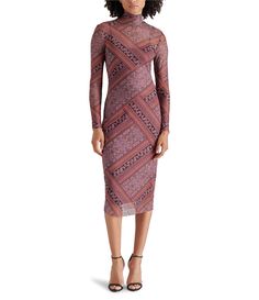 From Steve Madden&#x2C; this dress features:Mesh fabricationPaisley printTurtleneckLong sleevesPullover constructionApprox. 47.5" in lengthPolyester/spandexHand washImported.