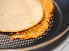 two tortillas sitting on top of a frying pan