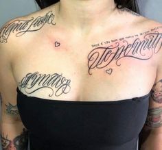 a woman with some tattoos on her chest