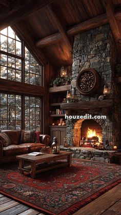 a rustic living room with stone fireplace and wood paneled walls, leather couches and rugs