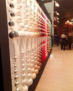 a display case filled with lots of different colored ornaments