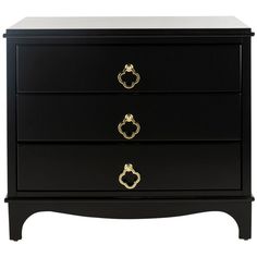 a black dresser with three drawers and two gold pulls on the bottom drawer, against a white background