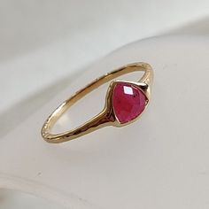 ITEM DESCRIPTION: >>The ring is made from Solid 14K Yellow Gold.  >>Gemstone used is absolutely natural and ethically sourced.  >>Natural Ruby in trillion shape and bezel setting is studded on it with utmost precision.  Gem: Ruby Gem size & shape: 6mm and Trillion shape Gem weight: 0.68 carats Gold purity: 14K (58.33% approx.) Gold weight: 1.22 grams Gross weight of ring: 1.36 grams The Gold purity is guaranteed and it comes with authentic 14K gold hallmark. Since these Rings are handmade, they are Nickel/Lead FREE.  CUSTOMIZATION: >>Size Customization is available for this ring and it is available in all ring sizes. >>Gemstone customization is also available and the main gemstone can be substituted with a gem of your choice. **Kindly drop a message for the same** CUSTOMER SUPPORT: We are Unique 14k Gold Ruby Ring As Gift, Unique Ruby Ring With Bezel Setting For Anniversary, Ruby Open Ring With Bezel Setting As A Gift, Gift Ruby Ring With Bezel Setting In Open Design, Gift Ruby Open Ring With Bezel Setting, Faceted Ruby Ring As Fine Jewelry Gift, 14k Gold Ruby Ring, Gold Ruby Ring, Gem Ruby