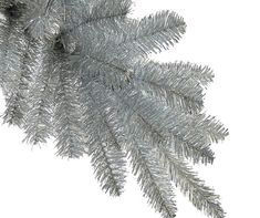 silver tinsel christmas tree branches against a white background