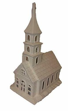 a white model of a church with a steeple