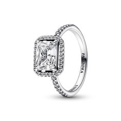 PRICES MAY VARY. Vintage-Inspired Ring: Adorned with a sparkling halo of cubic zirconia stones and showcases a prominent rectangular radiant-cut stone as a stunning centerpiece PANDORA Timeless Collection: A timeless, elegant, and versatile collection with sparkling stones as their centerpiece, for those you cherish and those that cherish you Features CZ: Cubic zirconia could be said to be the jewel in PANDORA's crown, making up the majority of stones we use in our jewelry because it optically l Pandora Set, Timeless Ring, Bracelet Pandora, Pandora Rings, Promise Rings For Her, Thomas Sabo, Radiant Cut, Multi Stone Ring, Halo Ring