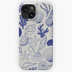 an iphone case with blue and white shells on it