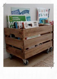 a wooden crate filled with books on wheels