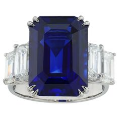 An important sapphire and diamond ring, the octagonal-cut sapphire weighing 16.73 carats accompanied by GCS Report stating to be of Sri Lankan origin, set between four emerald-cut diamonds weighing 3.24 carats in total, (0.86ct E VVS2, 0.81ct E VS1, 0.81ct F VVS2 and 0.76ct E VVS2) accompanied by De Beers reports, all claw-set in platinum mount, the head measuring approximately 2.3 x 1.7cm, finger size N, gross weight 11.6 grams. This magnificent sapphire and diamond ring comes from the collecti Jewelry Design Drawing, Fine Jewelery, Sapphire And Diamond Ring, Three Stone Diamond, Jewels Rings, Jewelry Luxury, Victorian Rings, Ring Art Deco, Royal Jewels