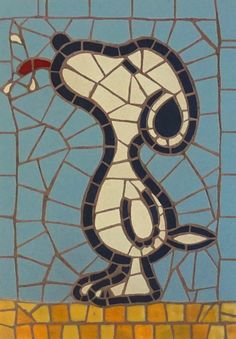 a mosaic with a snake on it's back and the words i love you