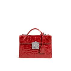 A signature Rubeus jewelled treasure that testifies to the power of classical elegance and Italian artistry. Born as the perfect Christmas present, the Flash Natale dominates all the year around. Small Natale Bag in rouge shining crocodile with palladium closure and adjustable crocodile strap. Interior slip pocket Measurements : 20x15x5.5 cm Made in Italy Luxury Red Bags With Crocodile Pattern, Luxury Crocodile Pattern Bags For Gifts, Luxury Crocodile Pattern Bags As Gift, Elegant Red Bags With Silver-tone Hardware, Elegant Bags With Silver-tone Hardware As A Gift, Elegant Red Rectangular Case Bag, Elegant Crocodile Pattern Bag For Gift, Red Evening Bag With Crocodile Pattern, Red Evening Bags With Crocodile Pattern