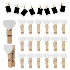 wooden clothes pegs with white hearts and black photo frames hanging on the clothes line