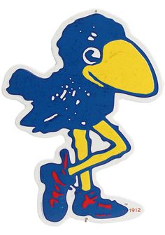 a blue and yellow bird sticker sitting on top of a white surface