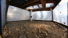 an empty room with white walls and wood beams on the ceiling is seen through a fish eye lens