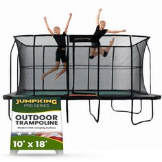 two people are jumping on a trampoline