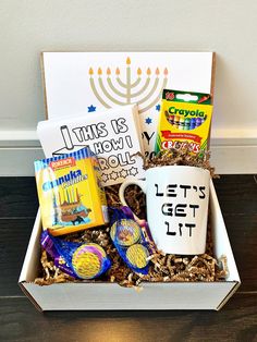 a gift box filled with coffee, candy and other items for hanukkah