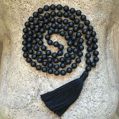 Black Matte Onyx Beaded Mala Necklace placed onto a white stone slab Angel Aura Quartz Necklaces, Knotted Mala, Meditation Prayer, Chakra Beads, Beads Mala, Necklace Collar, Stone Wrapping