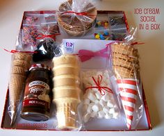 an ice cream social kit in a box is packed with marshmallows, pretzels, hot dogs and other treats