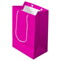 a pink shopping bag with white handles