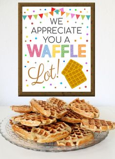 waffles are stacked on top of each other in front of a sign that says, we appreciate you a waffle lot