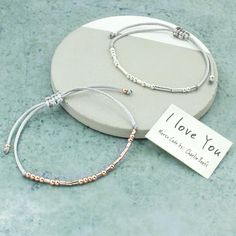 Available in grey rope and Rose Gold beads or silver beads.Tell someone you love them with this Morse Code dots and dashes bracelet. It makes a thoughtful and unusual gift that can be worn as a reminder of your sentiments. 'I Love You'....The words we all want to hear at some point.PLEASE READ THIS VERY IMPORTANT INFORMATION:US / CANADA / AUSTRALIA / Other NON-European countries:Etsy say 3-7 days Royal Mail (UK postal service) . This is unrealistic. It takes about a week not less. HOWEVER my exp Silver Beaded Friendship Bracelet, Silver Friendship Bracelets With Silver Beads, Adjustable Silver Friendship Bracelet For Best Friend, Silver Adjustable Friendship Bracelet For Best Friend, Adjustable Friendship Bracelets With Silver Beads As Gift, Gray Bracelet With Silver Beads For Gift, Adjustable Gray Bracelet With Silver Beads, Adjustable Gray Bracelets With Silver Beads, Everyday Silver Friendship Bracelets With Letter Beads