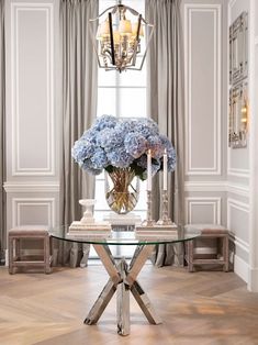 a table with flowers and candles on it in front of a chandelier that reads inspiration book