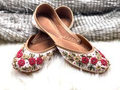 Ethnic Indian/Pakistani style shoes durable, hand stitched with genuine leather sole and leather padded cushion inside. Unique floral design with cute pink flowers and green leaves to match it. Perfect for floral lovers who just can't get enough of floral patterns. Indian zardozi work on all sides  Sizes available US 5,6,7,8,9,10,11. Shipped from USA. Closed Toe Flats With Handwork For Summer, Embroidered Leather Flats With Flat Heel, Leather Embroidered Flats, Embroidered Leather Slip-on Flats, Handwork Flats For Summer Festival, Traditional Pink Sandals With Round Toe, Festive Embroidered Leather Flats, Summer Festival Flats With Handwork, Festive Summer Slip-on Flats