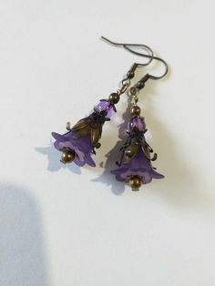 Purple Victorian bronze flower earrings lavender flower set necklace earrings Purple flower earrings Boho bronze earrings gift Gorgeous Victorian style jewelry set necklace and earrings . Bohemian necklace and earrings . Beautiful Set of bronze-tone Antique style lavender purple plastic flowers  and beautiful ornamented caps necklace and earrings. Bronze Victorian style necklace and earrings. Boho necklace. Bohemian necklace and earrings. Romantic necklace and earrings. Royal style jewelry set. Baroque style jewelry set. Antique style jewelry set. Gothic style jewelry set.  Perfect Gift for girlfriend,  mother,  sister,  bridesmaids or Maid of honor. Gift for special people or jewelry set for your special occasion. You may choose from the options menu from: earrings,  jewelry set necklace Bohemian Metal Jewelry With Flower Charm, Bohemian Dangle Jewelry With Flower Charm, Handmade Purple Copper Jewelry, Purple Flower Jewelry For Jewelry Making, Flower Shaped Brass Jewelry With Matching Earrings, Bronze Flower-shaped Jewelry Gift, Purple Metal Drop Earrings, Bohemian Metal Flower Earrings For Gift, Bohemian Metal Flower Earrings As Gift