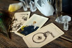 some cards are sitting on a table next to an object