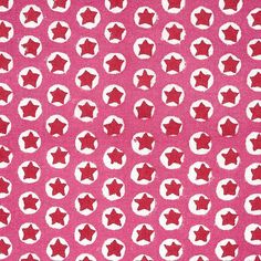 pink and white fabric with red stars on it