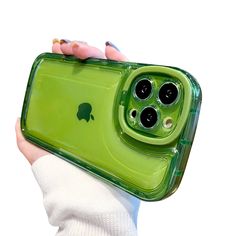 a person holding an iphone case in their hand with the back cover partially open to show the camera