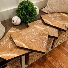 four wooden coasters sitting on top of a table next to a vase and ball