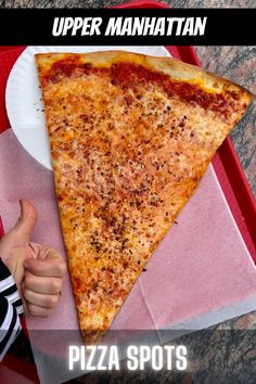 a slice of pizza sitting on top of a paper plate with the words upper manhattan above it