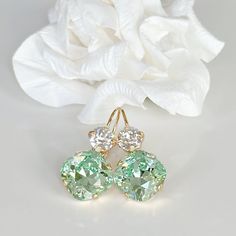 "Sparkly, eye-catching, chrysolite green and clear crystal earrings will brighten up any outfit! Swarovski's precision-cut crystals and unmatched, gorgeous colors are always show-stoppers! Details: * Square Swarovski Crystals- 1/2\"( 13mm), 3/8\"(10mm) * 14k Gold-plated lever back Earrings  * Earring Length- 1 1/4\"(30mm) * Lead and Nickel-free * Earrings come in a jewelry bag and box with ribbon. The link to the colorful orange earrings- https://www.etsy.com/listing/1721152117/yellow-orange-crystal-drop-earrings?click_key=a2122a70736e3345002545b74c491d62fa76ce38%3A1721152117&click_sum=4972b409&ref=shop_home_active_7&frs=1&sts=1" Clear Crystal Earrings, Orange Crystals, Orange Earrings, Nickel Free Earrings, Swarovski Crystal Earrings, Colorful Jewelry, Crystal Drop Earrings, Crystal Drop, Wedding Jewelry Earrings