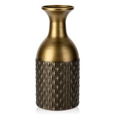 a gold vase with an intricate design on the front and bottom, sitting on a white surface