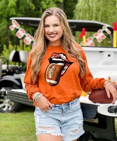 This Football Tongue Graphic Shirt is perfect for the sassy ladies who love cheering their team to victory in style! From football parties to tailgates on campus this football tongue shirt is perfect for any football loving lady!

* 6.0 oz., pre-shrunk 100% cotton* Double-needle stitched neckline and sleeves* Quarter-turned* Seamless seven-eighths inch collar* Taped neck and shoulders* Satin label* Rib cuffs Sports Crafts, Lips Graphic, Football Parties, Sport Craft, Football Design, Graphic Tee Shirt, Sport Football, Graphic Shirt, Graphic Tee Shirts