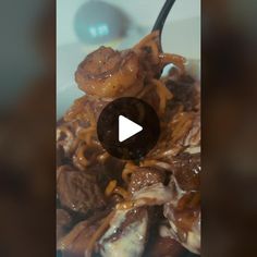 a bowl full of food with a spoon sticking out of it's top and the video is being viewed