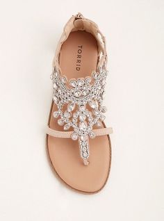 a pair of sandals with jewel embellishments