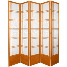 an orange room divider with white flowers and leaves on the glass paneled doors