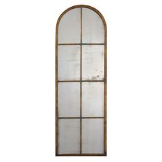 an arched window with glass panels on the outside and inside, against a white background