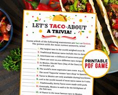 a taco - about trivia game sits on a table next to a bowl of salad