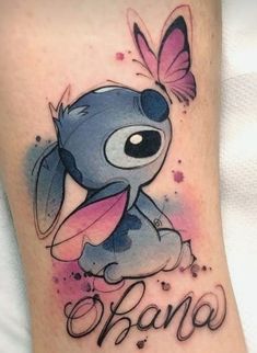 a tattoo with an image of stitchy and the word's name on it