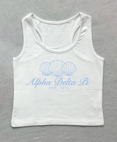 a white tank top with blue writing on the chest and an image of two seashells